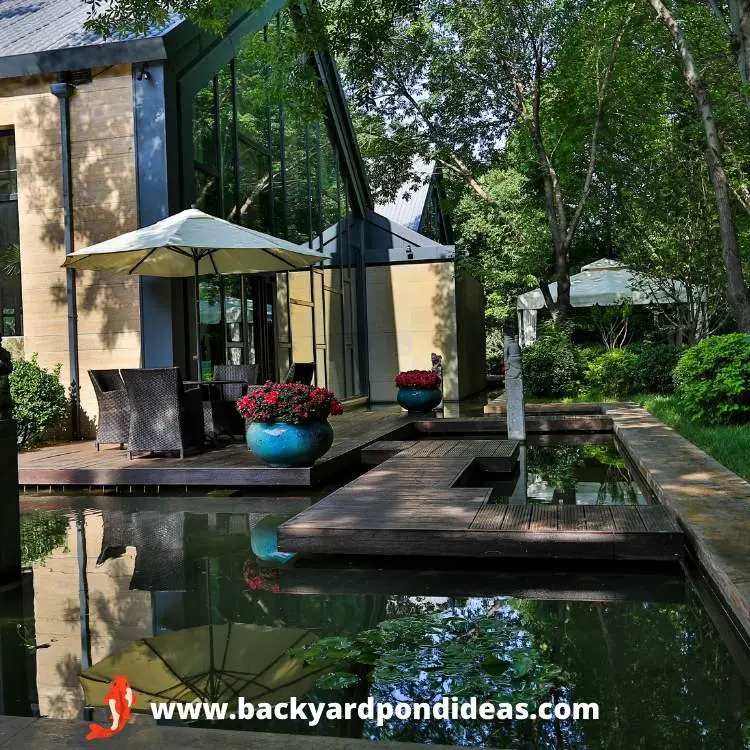 A modern Koi pond design next to a house.